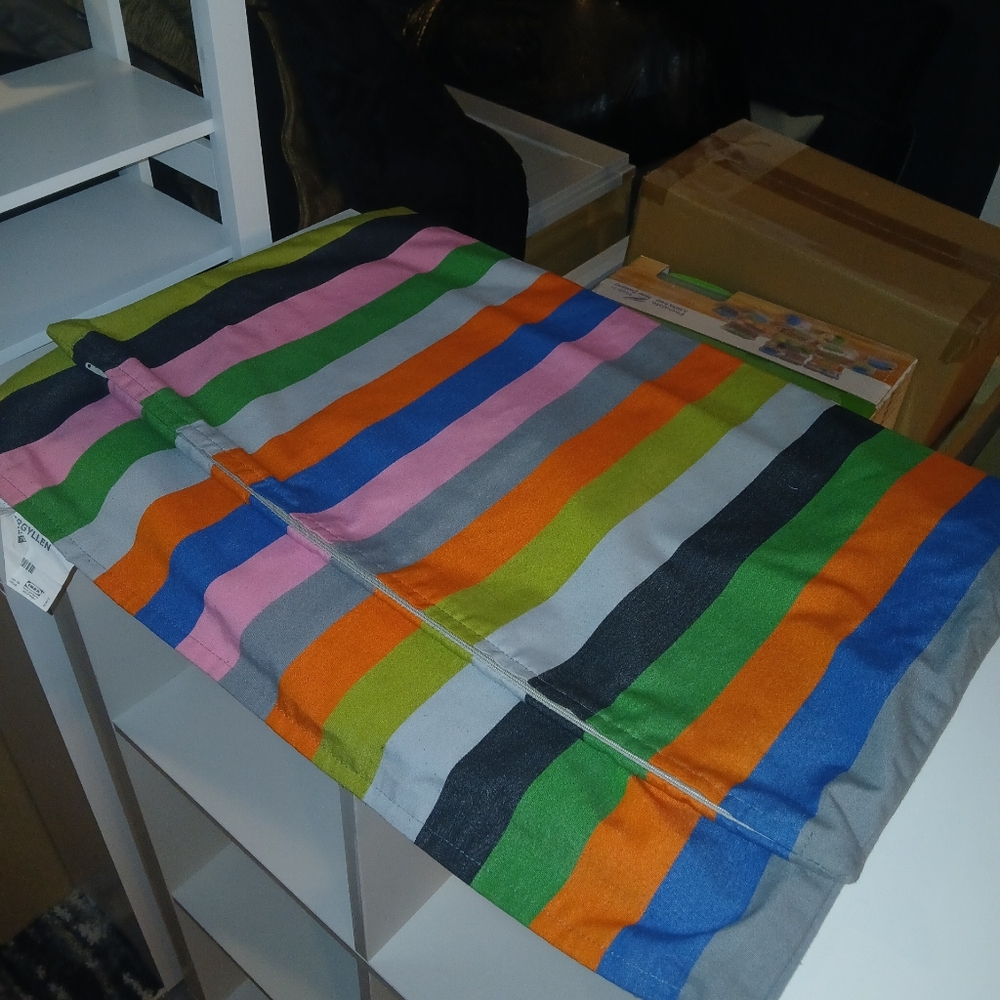 Three matching 20"x20" multi-color IKEA pillow covers with zippered closure